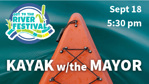 Orange kayak on blue green water