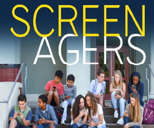 group of teenagers sitting outside on stairs looking at cell phones