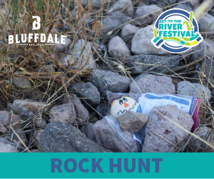 Up close of a pile of rocks with a painted rock hiding